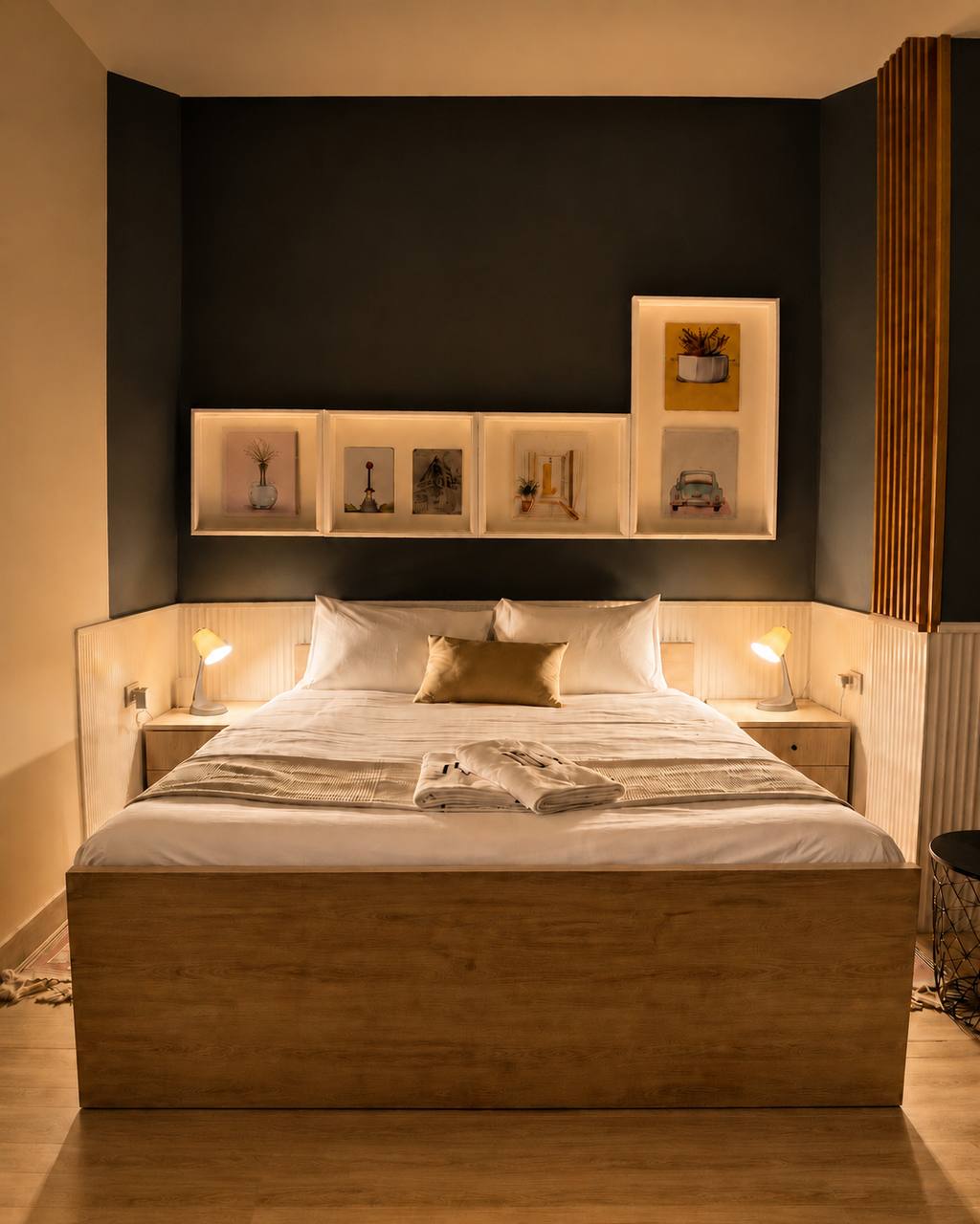The Loft — bedroom with framed prints