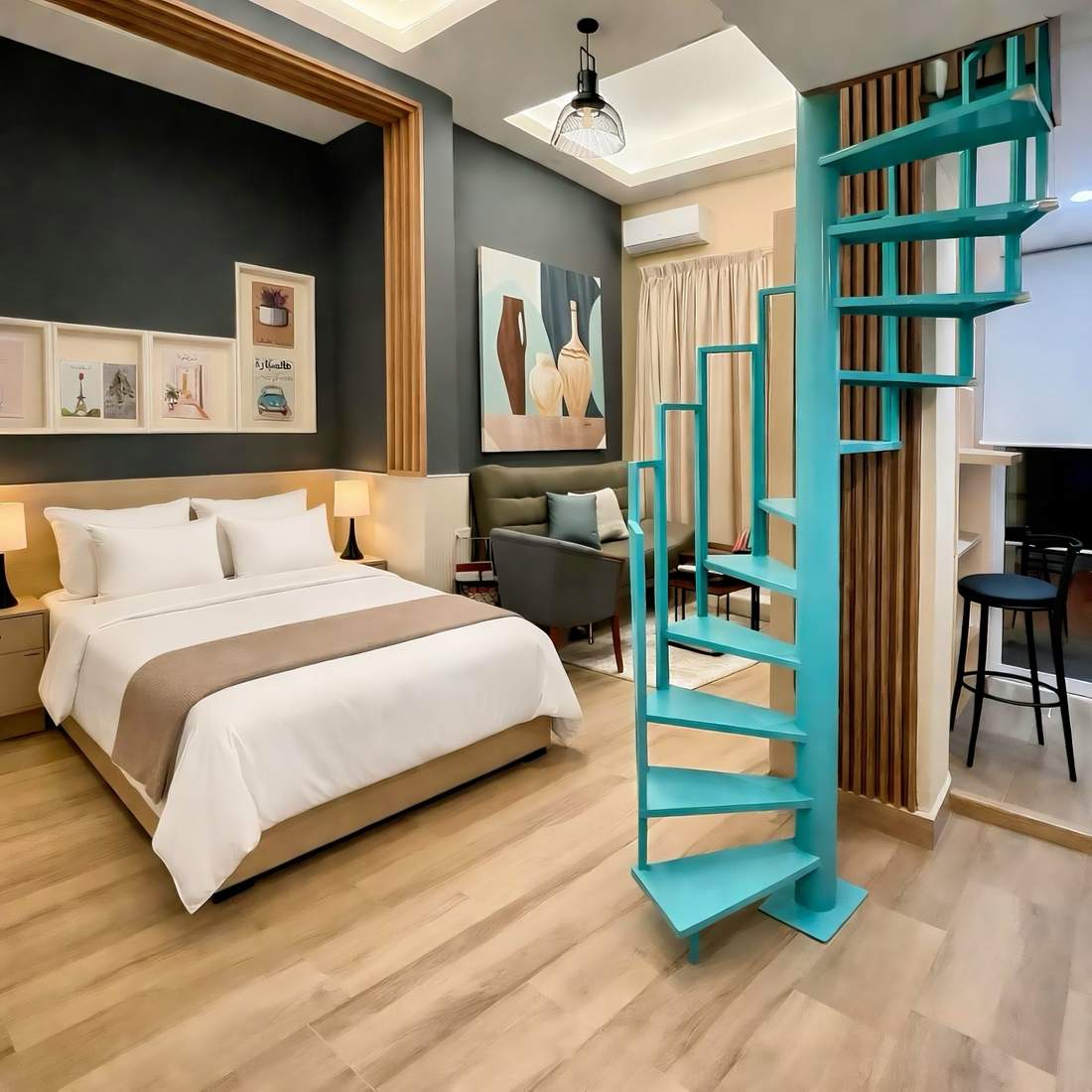 The Loft &mdash; duplex with teal spiral staircase
